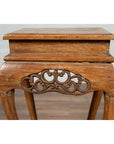 Brown wooden incense stand with cabriole legs and carved apron, rustic finish, Ming style, photographed indoors.