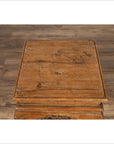 Brown wooden incense stand with cabriole legs, Ming style, on wood-patterned floor indoors.