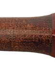 Close-up of brown wooden Chinese opium pillow end showing textured surface, natural grain, and flared angled mouthpiece.