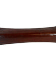 Dark brown wooden antique opium pillow with curved rectangular shape and gently rounded sides, close-up view.