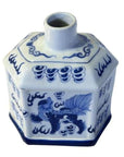 Blue and white painted ceramic bottle with hexagonal shape, narrow neck, and mythical creature on white background.