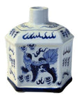 Blue and white ceramic bottle with hexagonal shape, animal and cloud designs, short narrow neck, on plain background.