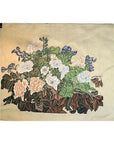 Beige silk with embroidered white and peach roses, green leaves, and purple flowers, close-up.