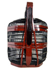 Black and red Chinese picnic basket with tall central handle, front view, in very good condition.