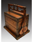 Brown wooden box with metal accents, cutouts, handle, and rustic side supports on plain background.