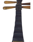 Close-up of black Chinese PiPa lute fingerboard with tuning pegs and a damaged fret on white background.