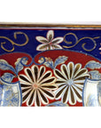 Close-up of a blue and red Chinese porcelain planter with hand-painted floral patterns.