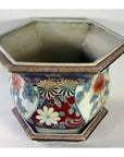 Multi-color floral Chinese porcelain hexagonal planter, hand-painted, on white background, top view.