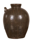 Dark brown glazed ceramic water jug with petite spout, round shape, on plain white background.