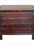 Red lacquer wood side cabinet with flat lid and visible wear, vintage Chinese style, shown in a studio setting.