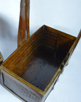 Red lacquered wood Shandong wedding box with hinged handles on a white background, viewed from above and side.