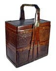 Brown woven bamboo rectangular wedding box with sturdy handle, metal clasp, intricate pattern, cracked top cover.