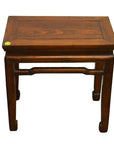 Dark wood Chinese side table with four sturdy legs and a rectangular top, overhead view.