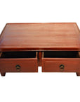 Reddish-brown wood Chinese Low Kang coffee table with two open drawers and round metal handles, front view.
