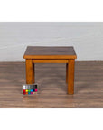 Natural wood Chinese vintage side table on wood floor, color card placed beside left leg, contemporary design.