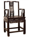 Dark wood Chinese wedding chair with curvy pierced splat and serpentine arms, traditional style, close-up view.