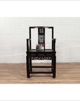 Dark wood Chinese wedding chair with curvy pierced splat and serpentine arms on wooden floor, color chart beside.