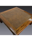 Light wood and rattan square coffee table with lacquer finish, pictured on a gray background.