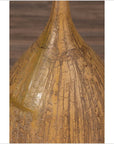 Close-up of mustard ceramic vase with vertical texture and tapered spout, handmade in Thai style.
