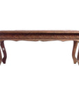Copper coffee table with curved legs and intricate carvings, displayed against a plain white background.