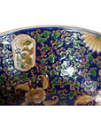 Close-up of blue, green, and gold Ming porcelain bowl with intricate patterns in very good condition.