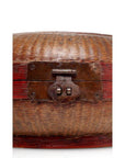Close-up of a hand-painted woven basket with red accents and a rusty latch.