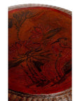 Reddish-brown woven basket with round wooden lid carved with lotus flowers and leaves, close-up view.