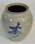 White ceramic Japanese crackle vase with blue calligraphy, antique style, top view.