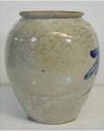Close-up of round beige ceramic vase with fine crackle glaze and blue calligraphy, antique Japanese style.