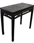 Dark stained wood Chinese altar table with rectangular top and straight legs, antique design, studio background.