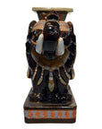 White ceramic elephant garden stool with decorative saddle, rectangular base, front view.