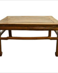 Rectangular elm wood coffee table with sturdy legs, front view, on a white background.