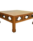 Square elm wood coffee table with hand-carved geometric sides and sturdy legs, front view.