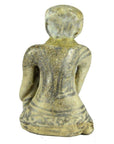 Brown glazed terracotta fertility doll miniature, seated, back view, with patterned surface details.