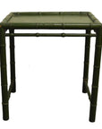 Green bamboo-style side table with square top, natural look, close-up of legs and edges.
