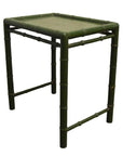 Green bamboo-style square side table with four legs, bamboo-inspired frame, close-up view against plain background.