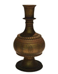 Brass hammered Indian urn with bulbous body, narrow neck, wide round base, and engraved patterns, close-up.