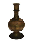 Brass hammered urn with engraved patterns, wide base, and narrowing neck, close-up view.
