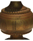 Silver hammered metal urn close-up with engraved patterns and paisley motifs.