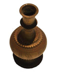 Vintage brass urn with intricate engravings, hammered finish, shown on a white background, top view.
