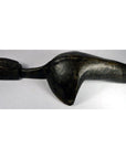 Close-up of a dark wood hand-carved Saringda lute in a stylized bird shape, inspired by Northern India folk fiddles.