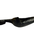 Close-up of dark prosthetic leg with foot shaped like a hand-carved Indian Saringda lute, amputee style.