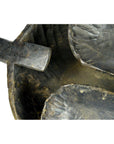 Close-up of brown wood carved Saringda lute with curved bowl and handle, indoors.