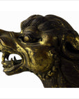 Bronze animal head sculpture, hand carved, open mouth with teeth, cracked surface, missing tail.