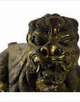 Close-up of gold-painted bronze Indonesian beast statue with bared teeth, tail missing, used condition.