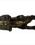 Gold and black hand-carved Indonesian beast figurine, close-up of used condition with tail missing and visible cracks.