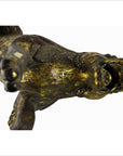 Bronze and gold hand-carved Indonesian reclining lion sculpture, missing tail, used condition, viewed from below.