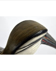 Close-up of hand carved wooden Indonesian kiwi bird head and beak, shown next to a 10 inch bag for size comparison.