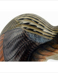 Close-up of hand carved wooden Indonesian kiwi bird with detailed brown, tan, and black feather patterns.
