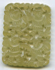 Green jade medallion, hand carved with four stylized human figures and patterns, close-up, 2-inch size comparison.